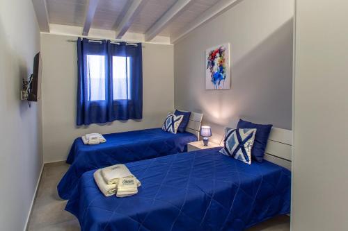 Postel nebo postele na pokoji v ubytování Onda Bianca Luxury Apartments