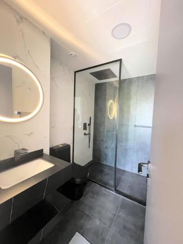 a bathroom with a sink and a shower at Villa United Arab Emirates in Ras al Khaimah