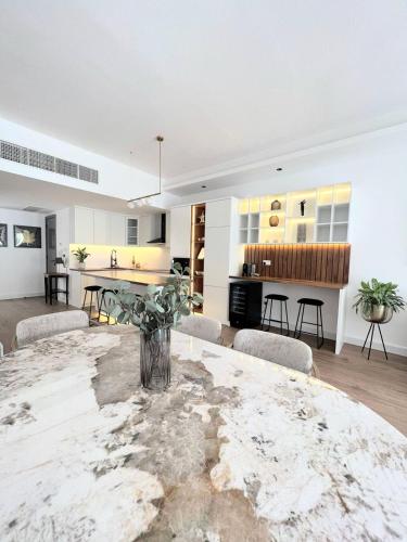 a large kitchen and living room with a large table at Villa United Arab Emirates in Ras al Khaimah