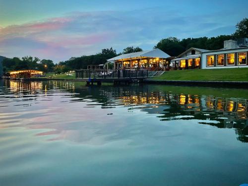 a restaurant next to a body of water at Lake Austin Spa Resort - All Inclusive in Austin