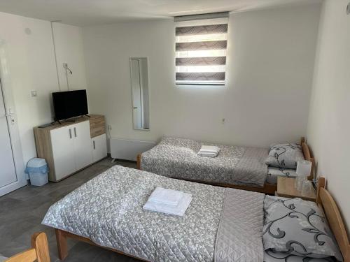 Postel nebo postele na pokoji v ubytování Rooms Enna