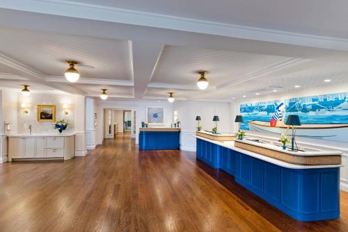 a large room with a lobby with blue counters at White Elephant Hotel in Nantucket