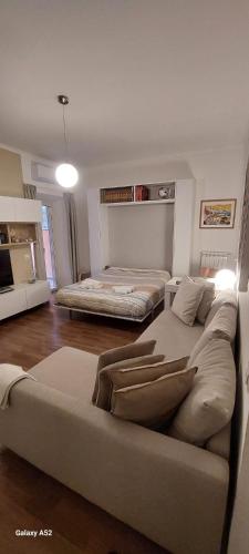a living room with two beds and a couch at Relax&Business Velletri Centro in Velletri