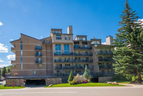 a large building with trees in front of it at Vantage Point #307 condo in Vail