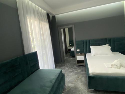 Postel nebo postele na pokoji v ubytování Hotel Leodori 2