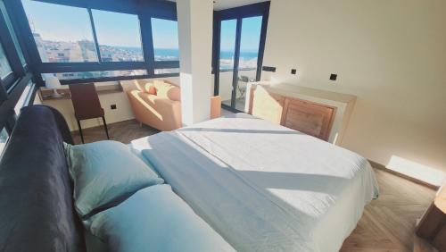 Krevet ili kreveti u jedinici u okviru objekta Appartement vue sur mer