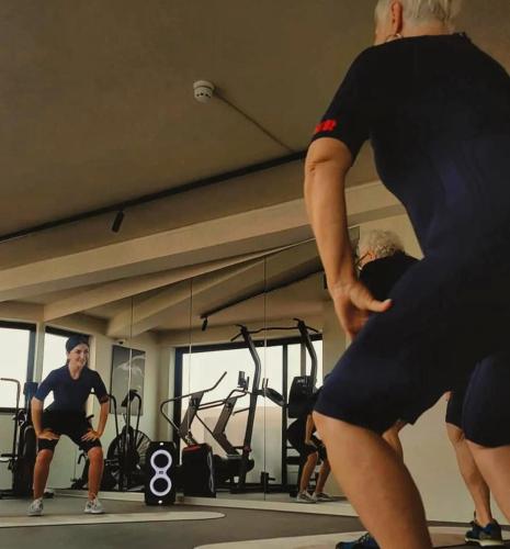 a group of people exercising in a gym at Park Heights by the Warren Collection in Msida