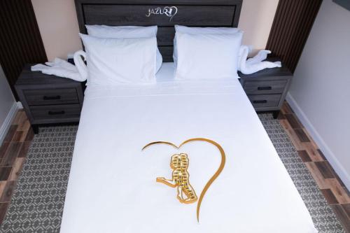 a bed with a gold skeleton on it at Jazuri Villa in Buccoo