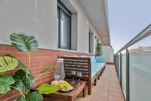 a patio with a couch and a table on a building at Apartment Pere IV in Barcelona