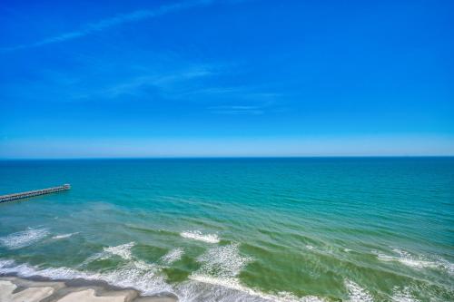 a view of the ocean with a pier in the water at Stunning Oceanfront King Suite on 18th Floor Centrally Located in Myrtle Beach