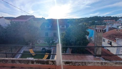 a view of a city from a balcony at Orion Guesthouse Telhado in Fundão