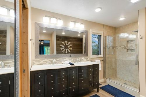 a bathroom with two sinks and a shower at Fairway to Heaven on Beech in Beech Mountain