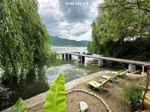 a view of a body of water with a pier at Orsova Gratca 164 in Orşova