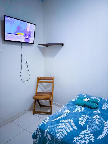 Μια τηλεόραση ή/και κέντρο ψυχαγωγίας στο Pousada Suites Jacumã