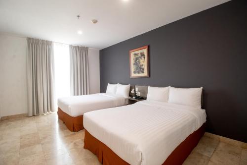 Postel nebo postele na pokoji v ubytování Memora Hotel & Villas Chapala