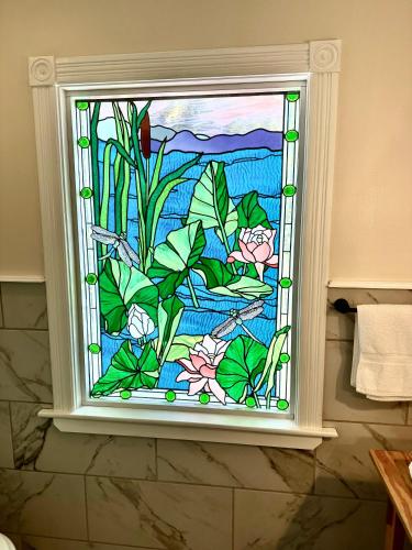a stained glass window in a bathroom at Orcas Hotel in Orcas