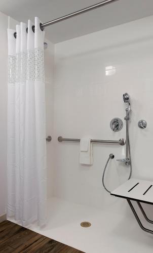 a shower with a white shower curtain in a bathroom at Hampton Inn and Suites Fort Mill, SC in Fort Mill