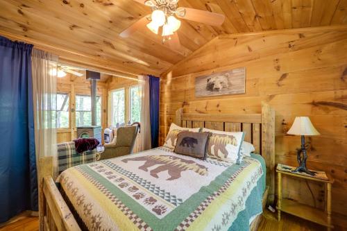 a bedroom with a bed in a log cabin at Hike, Soak and Unwind in Nature Blue Ridge Cabin in Marion