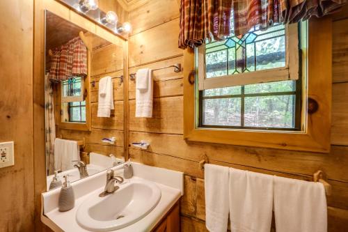 a bathroom with a sink and a mirror at Hike, Soak and Unwind in Nature Blue Ridge Cabin in Marion