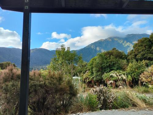 a view of the mountains from a bus window at Jackson's Retreat Alpine Holiday Park in Jacksons