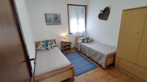 A bed or beds in a room at Pavoncelle Holidays Home