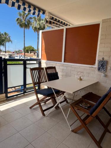 a white table and two chairs on a balcony at Apartament Sony in Denia