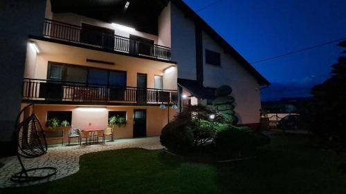 a large building with a yard in front of it at night at Apartman Katarina in Čakovec