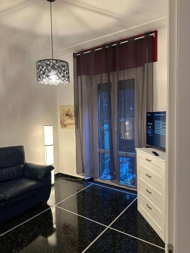 Una televisión o centro de entretenimiento en Da Luciano vicino Stazione Genova Piazza Principe