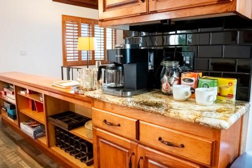 a kitchen with a counter with a coffee maker at The Mighty Pines Retreat + Large Patio + BBQ+View! in Lake Arrowhead