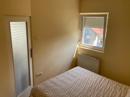 Postel nebo postele na pokoji v ubytování Apartment AN