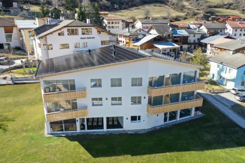 an aerial view of a large white building at Hotel Helvetia in Müstair