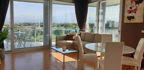 a living room with a couch and a table at Suite chocolat in Cuneo