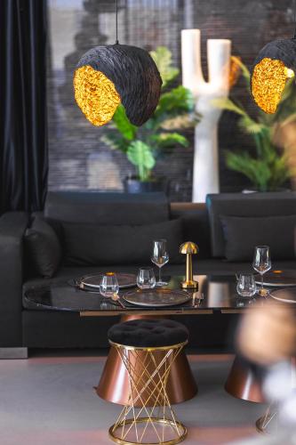 a dining room with a table with glasses on it at Luff Living - Adult Only 12 Plus in Antalya