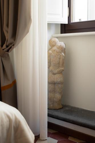 Postel nebo postele na pokoji v ubytování Palazzo D'Ambra Residenza d'Epoca