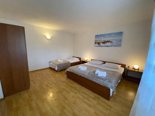 Ένα ή περισσότερα κρεβάτια σε δωμάτιο στο Apartments MATICIC
