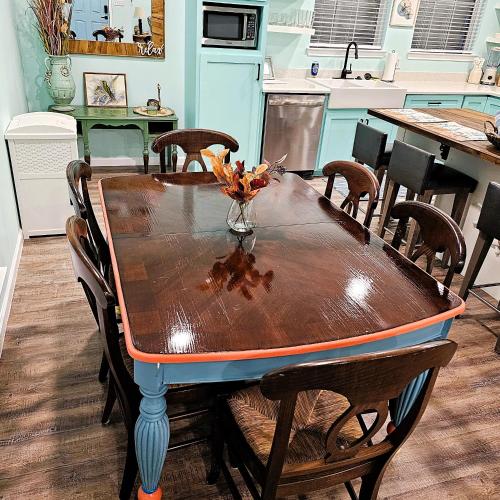 a kitchen with a wooden table with a table top at Pat's Perch in Rockport