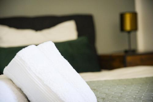 a close up of a bed in a hotel room at UNiQE I Stilvolle 115qm I Terrasse I BBQ in Feldafing