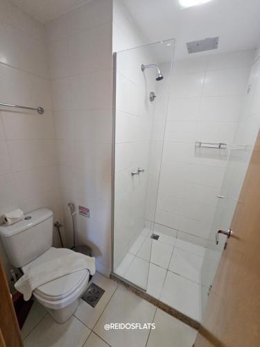 a bathroom with a shower and a toilet at Flat Saint Moritz Express By Rei dos Flats in Brasilia