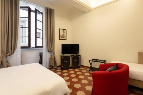 Postel nebo postele na pokoji v ubytování Palazzo D'Ambra Residenza d'Epoca