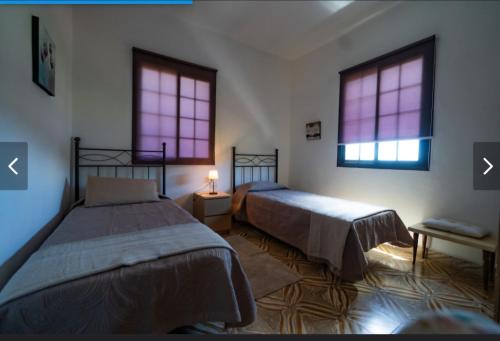 Ένα ή περισσότερα κρεβάτια σε δωμάτιο στο Casa Esteban Y Facunda