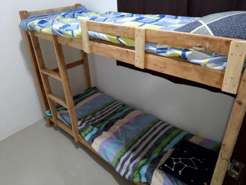 a pair of bunk beds in a room at Boarding house in Guinauayan