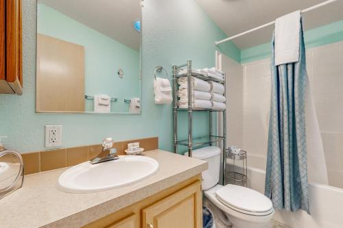 a bathroom with a sink and a toilet at Blue Heaven Beach House in Rockaway Beach