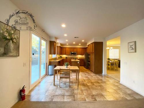 a kitchen and dining room with a table and chairs at Bella's sweet house 5640 in Eastvale