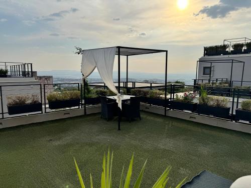 an outdoor area with a tent on the roof of a building at Ilo Rojo Hotel Boutique in San Miguel de Allende
