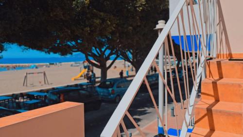 a view of the beach from the balcony of a building at La casita de Mercedes in Málaga