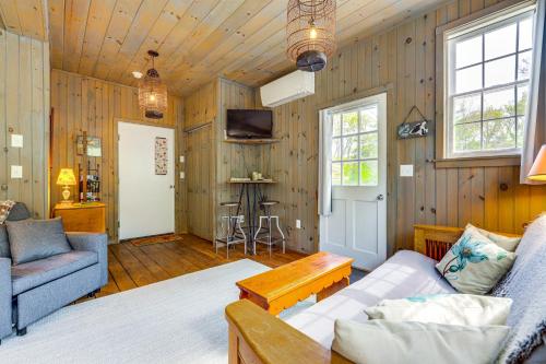 a living room with a couch and a tv at Killingly Barnyard Studio in Wine Country! in Pineville