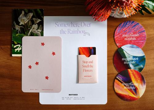 a table with a card and two olympic medals at Wayfinder Waikiki - Voted Top 10 Best Hotels in Hawaii! in Honolulu