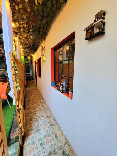 a hallway of a house with a window on the wall at Hostal Leyendas in León