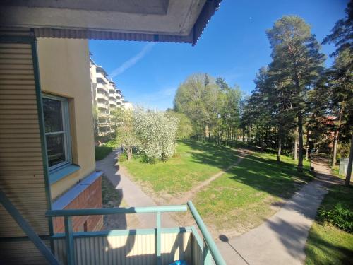 a balcony with a view of a yard at Jahminatu`s Apartment in Södertälje