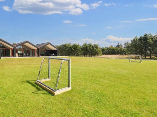 a soccer goal in a field of grass at 10 person holiday home in Jerup-By Traum in Jerup
